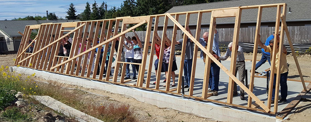 Habitat wall raise lg Wall raising at Habitat for Humanity build site